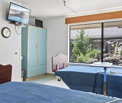 Bright resident room with a view of the garden