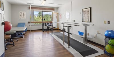 Physical therapy room with rehabilitation equipment