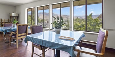 Dining area with tables and scenic window views