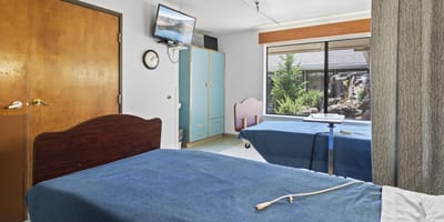 Interior view of a resident room with two beds