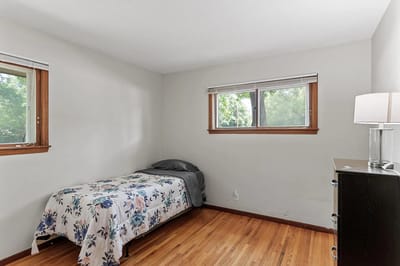 A private resident room with a bed and window