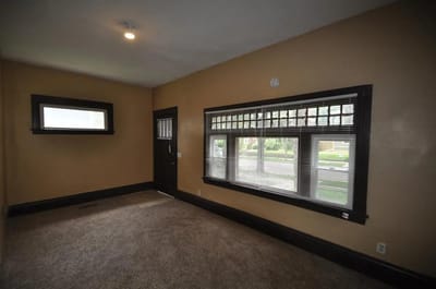 Interior view of a room with a window and door
