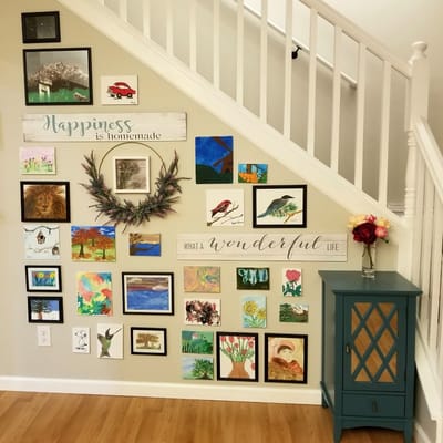 Gallery wall with resident artwork and decorations