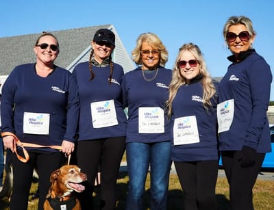 Group of staff members in matching shirts outdoors