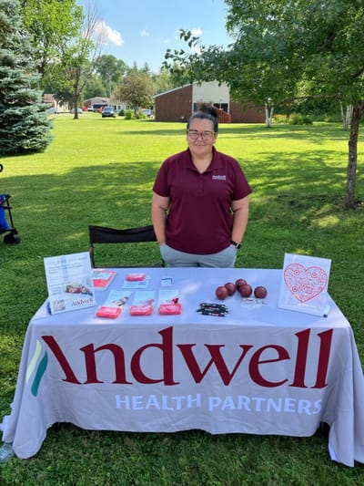Staff member at outdoor event table