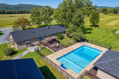 Aerial view of a pool area and outdoor space.