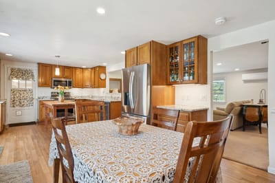 Cozy common area with kitchen and dining table.