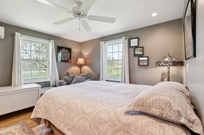 Cozy bedroom with a comfortable bed and natural light.