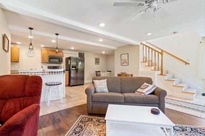 Cozy living room with furniture and stairs