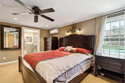Cozy bedroom with a queen bed and natural light.