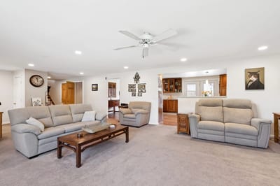 Cozy common area with sofas and decor.