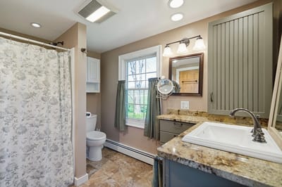 Bright bathroom with modern fixtures and large window.