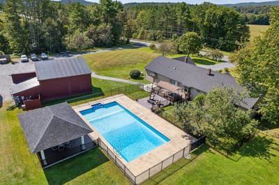 Aerial view of a pool and facility grounds.