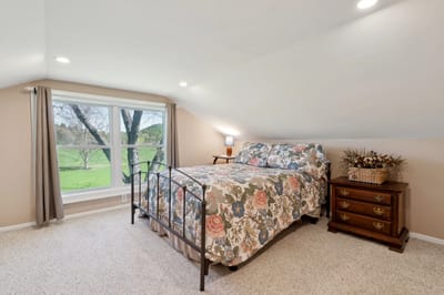 Cozy bedroom with floral bedding and window view