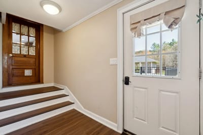 Entrance area with stairs and door