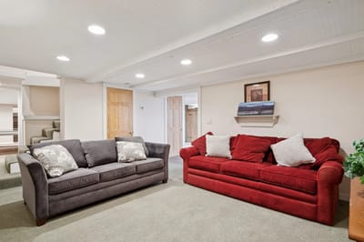 Cozy common area with two sofas and soft lighting.