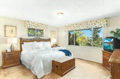 Cozy bedroom with natural light and decor.