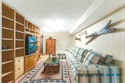 Cozy common area with seating and a television.