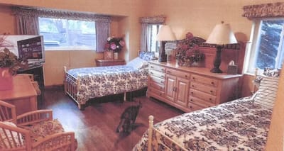 Cozy shared resident room with two beds.