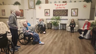 Residents enjoying activity in a common area.