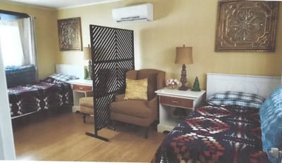Cozy shared resident room with beds and decor.