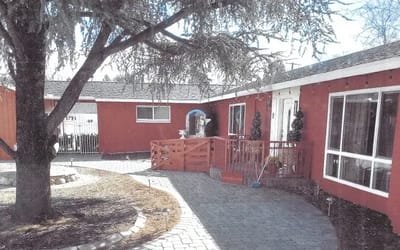 Outdoor courtyard with path and seating area.