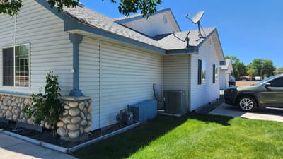 Exterior view of a residential building with lawn