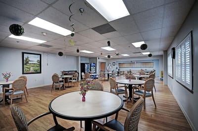 Interior view of a dining room with tables and chairs