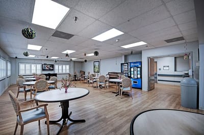 Bright common area with tables and chairs