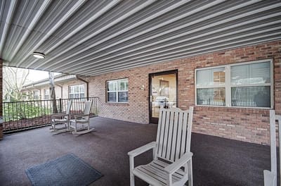 Porch area with rocking chairs at Claiborne County Senior Care