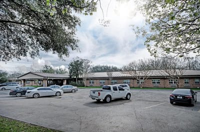 Exterior view of Claiborne County Senior Care with parking