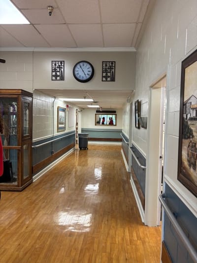 Bright corridor with a clock and decorations