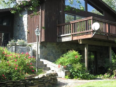 Exterior view of a senior living building with garden