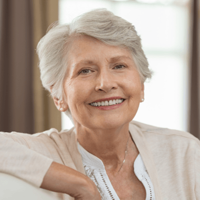 Smiling senior woman in a comfortable indoor setting