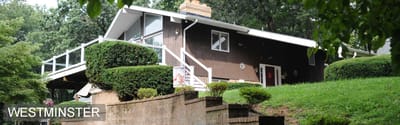 Exterior view of Westminster facility with a green lawn