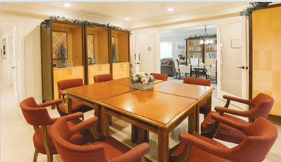A common area with a large table and chairs