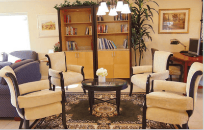 Common area with seating and bookshelves