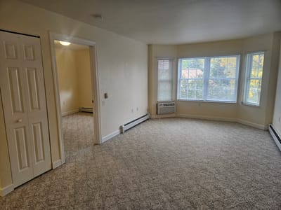 Bright, empty interior space with large windows