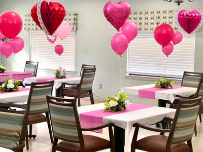 Decorated dining area with balloons for an event