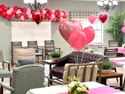 Decorated common area with balloons and hearts