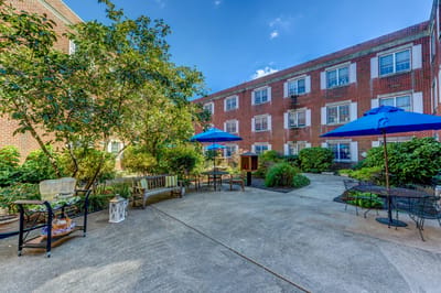A pleasant outdoor courtyard with seating and umbrellas