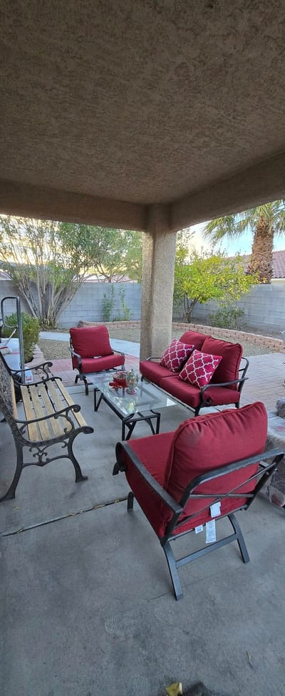 Outdoor seating area with red chairs and table