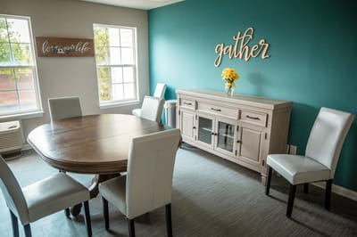 Bright interior common area with a dining table