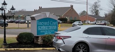 Exterior view of Vineyard Court Nursing Center sign