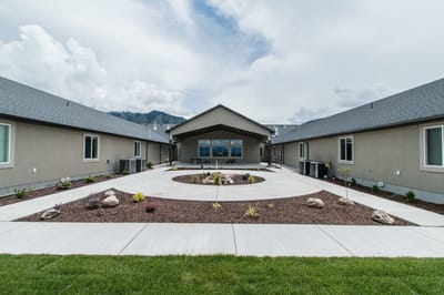 Exterior view of the assisted living facility with landscaping