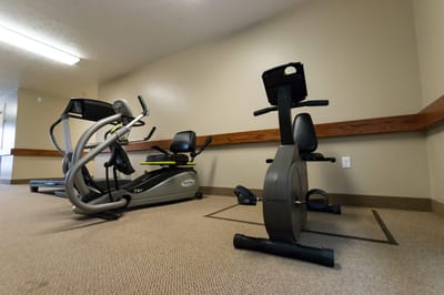 Fitness equipment in a well-lit gym