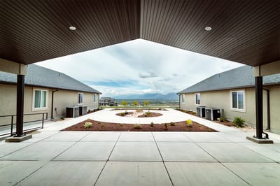 A view of a landscaped outdoor courtyard at Elk Ridge Assisted Living