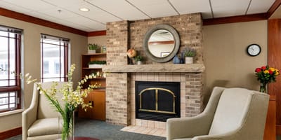 Cozy common area with seating and a fireplace