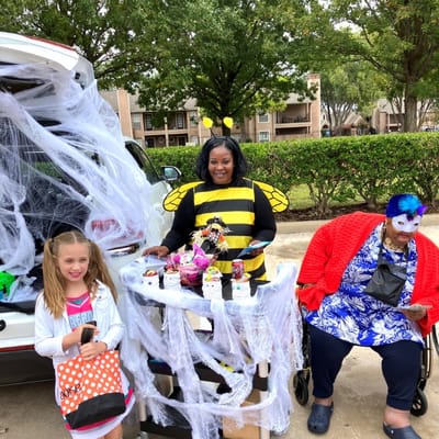 Staff and residents celebrating at an outdoor event