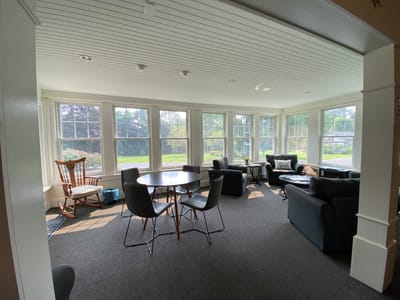 Bright common area with seating and natural light